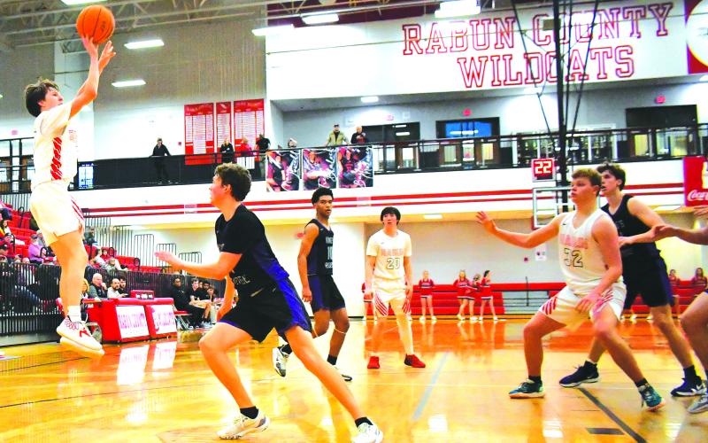 Luke Morey/The Clayton Tribune. RCHS freshman Huey Blalock rises up for a shot in the fourth quarter against King’s Ridge Christian. Blalock was the starting point guard for the Wildcats, finishing off his freshman season averaging six assists a game. In his last game of the season, Blalock led the team with eight points against King’s Ridge.