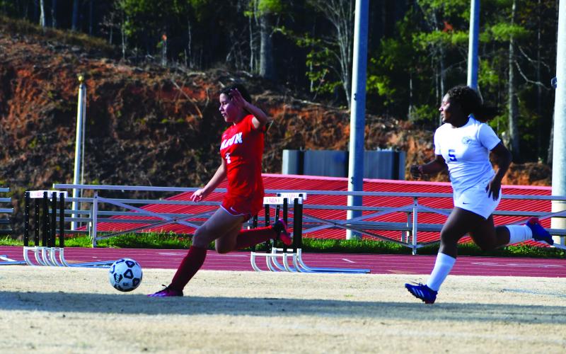 Luke Morey/The Clayton Tribune. Rabun County freshman Zara Apointe scores against Barrow Arts and Science Academy on Friday, March 24. Apointe has 15 goals in 12 games for the Lady Cats. After falling to Tallulah Falls, the Lady Cats next take on Commerce in the final game of the regular season.