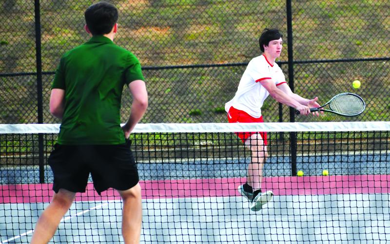 Luke Morey/The Clayton Tribune. RCHS senior Jayton Henry returns a shot against Tallulah Falls. Henry and Om Patel competed at No. 1 doubles against Zachary Carringer and Jake Owensby of Tallulah Falls. Henry and Patel fell 4-6, 2-6.