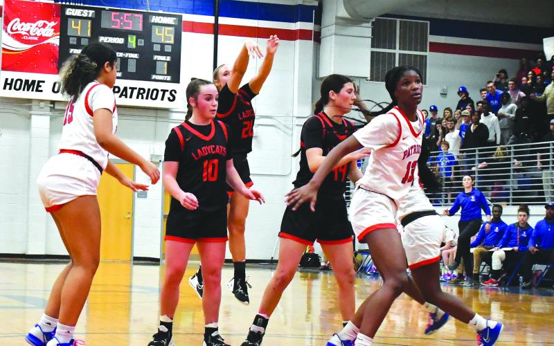 Luke Morey/The Clayton Tribune. Thanks to a two-way screen by senior Mary Lovell and junior Mili Watts, junior Ellie Southards hits an open three to bring the Lady Cats within a point in the fourth quarter of the Sweet Sixteen. Southards ended with 15 points in the 51-50 loss to Oglethorpe.