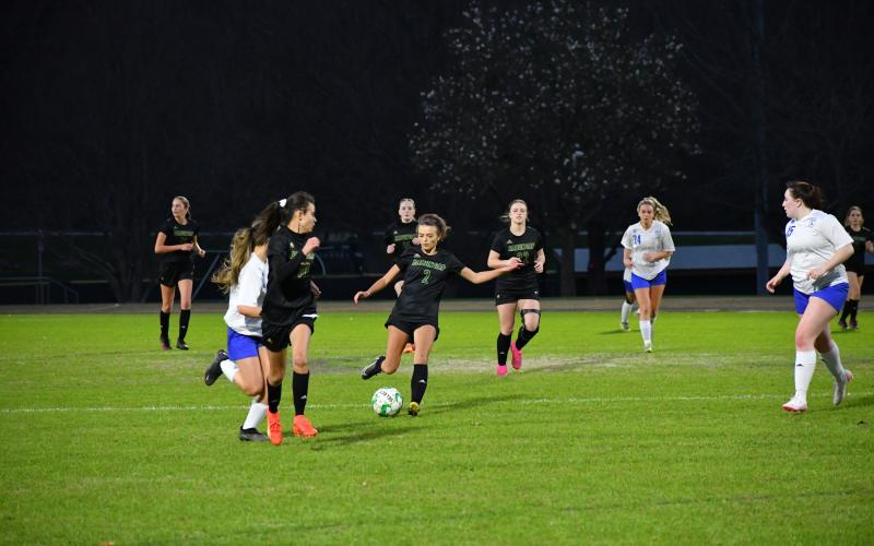 Luke Morey/The Clayton Tribune. Rabun Gap Lady Eagle Georgia Mattis (2) passes the ball ahead to Laea Blakely against Highlands School on Wednesday, March 8. Blakely and Mattis have helped push the Lady Eagles to a 6-0-1 record.