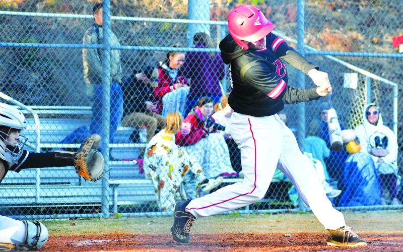 Luke Morey/The Clayton Tribune. Rabun County’s Parker Smith gets a hit against Elbert County on Tuesday, March 14 in the seventh inning. Smith later scored as a part of a late rally from the Wildcats that ultimately fell short with Elbert County winning 9-5. The Wildcats next travel to Elberton for a double header on Friday, March 17.