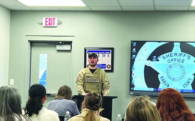 Submitted photo. K9 handler Clinton Scott talks with the group about canine officer training and canine participation in law enforcement.