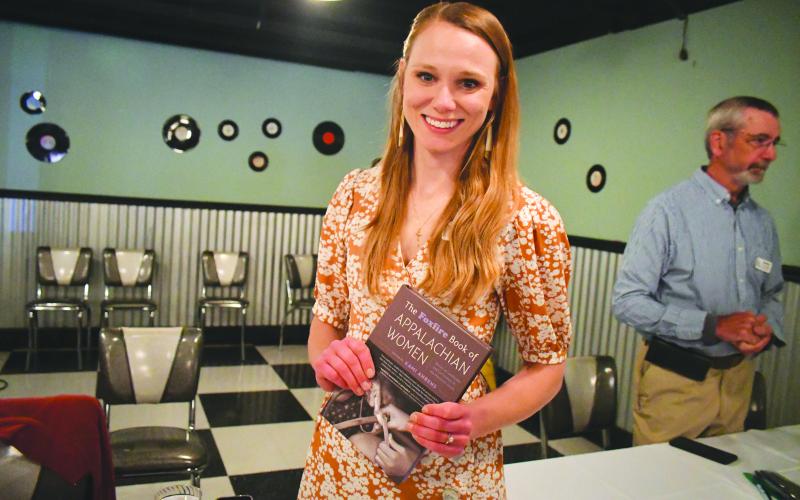 Megan Broome/The Clayton Tribune. Kami Ahrens, curator and director of education for Foxfire, is excited to hold a book launch event for the book she wrote and edited titled “The Foxfire Book of Appalachian Women: Stories of Landscape and Community in the Mountain South.” Crowds of people attended the event held at the Rabun County Civic Center Diner.