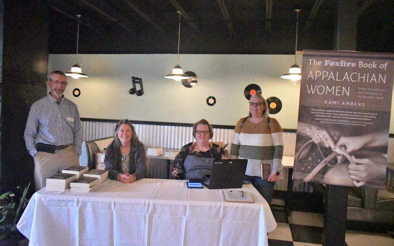 Foxfire Museum and Heritage Center workers Barry Stiles, Foxfire museum director; Cathy Stiles, fiscal operations manager; Christal Spalding, gift shop sales; and Jessica Parker, gift shop manager, attend the book launch for the newly released  “The Foxfire Book of Appalachian Women: Stories of Landscape and Community in the Mountain South” held in the Rabun County Civic Center Diner Saturday, March 11. The book was written and edited by Kami Ahrens, curator and director of education for Foxfire.