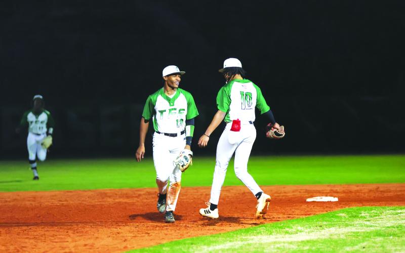 Photo courtesy Austin Poffenberger. Frankey Moree (13) and Rohajae Pinder celebrate after a victory over No. 1 ranked Elbert County on Friday, March 10. The victory was the first win in school history over a top-ranked opponent as the Indians are now 4-6 and 1-2 in the region. TFS next takes on Commerce in a double header on Friday, March 17.