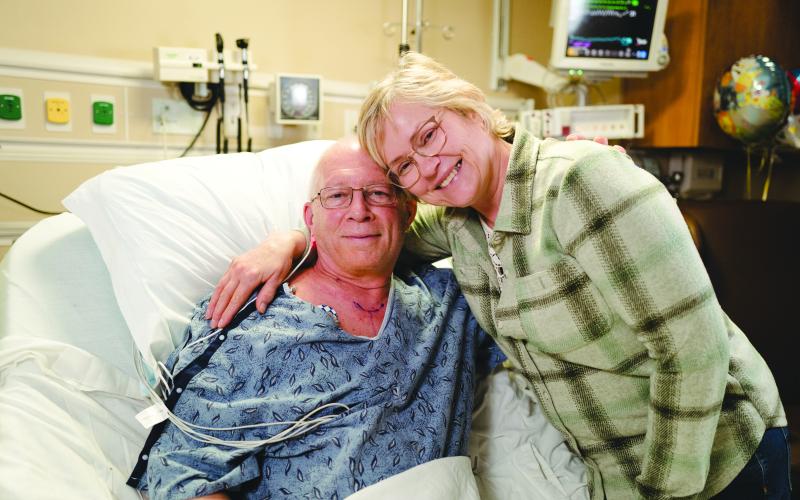 Submitted photo. Bill and Karen Mayfield, who traveled from Minnesota to Gainesville for Bill’s robotic heart surgery, wait to be discharged from Northeast Georgia Medical Center (NGMC) on Feb. 9, 2023 – just two days after Bill’s procedure. Bill was the first patient to ever receive robotic heart surgery at NGMC.