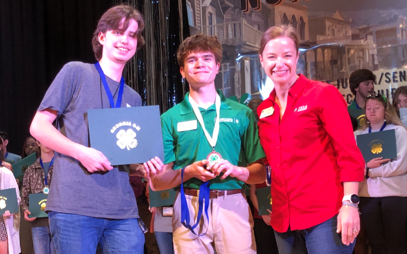 Photo courtesy Rabun County 4-H. Rabun County ninth grader Peyton Hicks (left) won first place in the Georgia 4-H Northeast District Project Achievement for veterinary science at Rock Eagle 4-H Center from March 10-12. Hicks is shown with Stephens County’s Luke Roesch, Northeast District senior board member; and Denise Everson, Northeast District extension director.