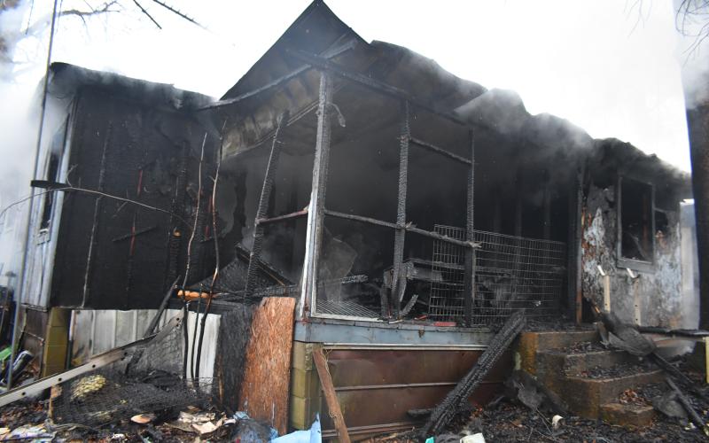 Megan Broome/The Clayton Tribune. Rabun County Fire Services deploys defensive and offensive tactics to knock down a structure fire at 338 Turpin Street in Tiger March 2. The structure was determined to be a complete loss.
