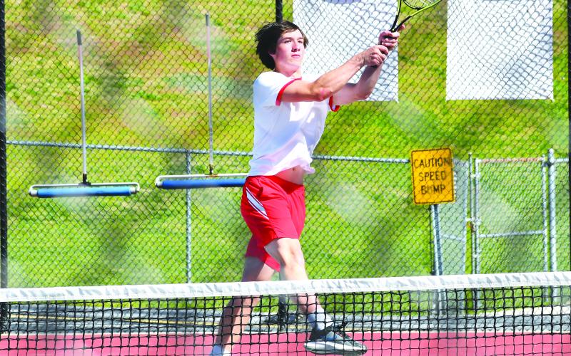 Luke Morey/The Clayton Tribune. RCHS senior Jayton Henry returns a ball against Mt. Pisgah on Monday, April 24. Henry is one of four Rabun County seniors.