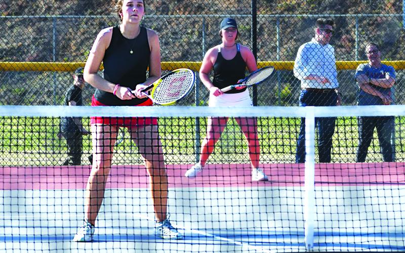 Luke Morey/The Clayton Tribune. Sophomore Ruby Richardson (left) and senior Allana Jones helped the Rabun County tennis team win the region semi-final round, facing off against Tallulah Falls in the championship on Wednesday, April 12.