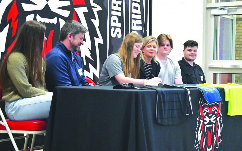 Luke Morey/The Clayton Tribune. Rabun County senior Hannah Thompson (center) signed her letter of intent to play soccer at Truett McConnell University on Wednesday, March 29. Joining Hannah are (from left), sister Grace, parents Joey and Marla, and brothers Luke and Aaron Thompson.