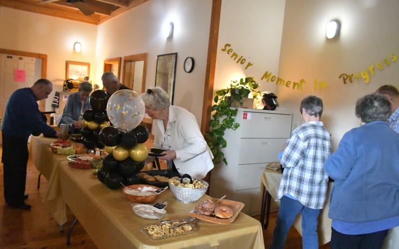 Megan Broome/The Clayton Tribune. Dozens of people attended a retirement party for Dr. Guy Gober at Tiger Clinic Friday, March 31. Tiger Clinic was decorated with balloons and banners congratulating Gober on his retirement.