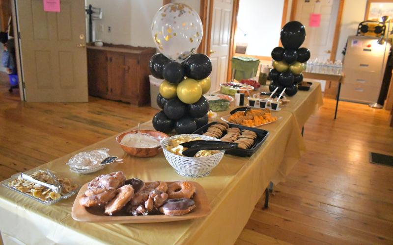 Megan Broome/The Clayton Tribune. Dozens of people attended a retirement party for Dr. Guy Gober at Tiger Clinic Friday, March 31. Tiger Clinic was decorated with balloons and banners congratulating Gober on his retirement.