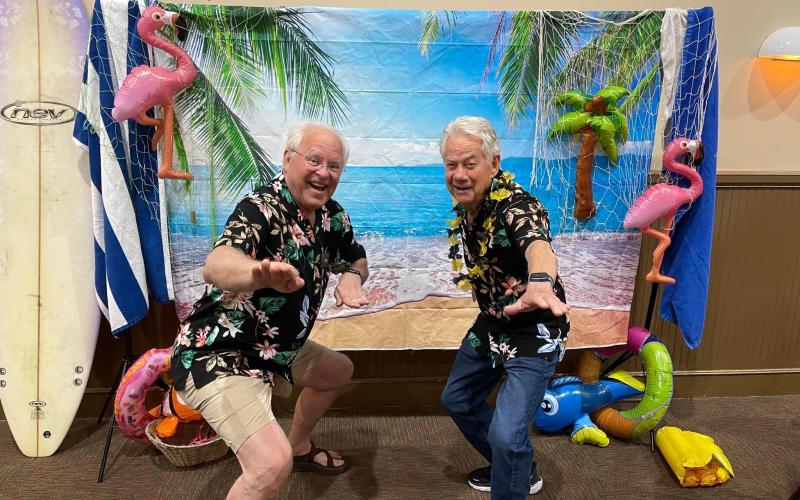 Submitted photo. Rotarians Jef Fincher and Ray Pagano enjoy the Rotary Club's Luau fundraising event April 22.