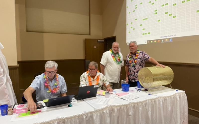 Submitted photo. Rotarians draw names for the Reverse Raffle throughout the evening April 22. James Brim was the winner of the $10,000 in the Reverse Raffle.
