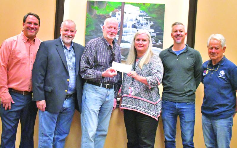 Megan Broome/The Clayton Tribune. Clayton Rotary Foundation, Inc. recently awarded a $20,000 grant to Rabun County Schools’ Needy Children’s Fund and presented the check to Superintendent Dr. April Childers. Pictured are Rotarian Todd Faircloth (left); Rotary President Leif Ericson; Rotarian and grant sponsor Matt Mitcham; Superintendent Dr. April Childers; Rotarian Eric Thurmond and Rotarian Ray Pagano.