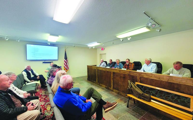 Megan Broome/The Clayton Tribune. Sky Valley council members hold its first meeting in the newly renovated City Hall building on Tuesday with attendees listening and observing the slideshow presentation of city reports.