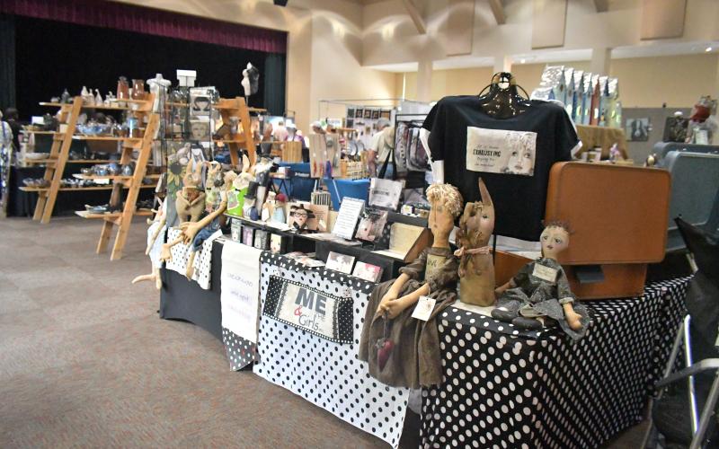 Megan Broome/The Clayton Tribune. The inaugural Sassafras Artisan Market presented by the North Georgia Arts Guild featured artists showcasing hand-made jewelry, photography, watercolor paintings, pottery, folk art, wood and metal art, fiber art, and much more. Crowds of people came out to enjoy the event April 29-30 weekend. It featured artists inside the Rabun County Civic Center and outside at the pavilions.