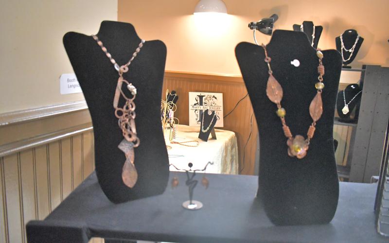 Megan Broome/The Clayton Tribune. The inaugural Sassafras Artisan Market presented by the North Georgia Arts Guild featured artists showcasing hand-made jewelry, photography, watercolor paintings, pottery, folk art, wood and metal art, fiber art, and much more. Crowds of people came out to enjoy the event April 29-30 weekend. It featured artists inside the Rabun County Civic Center and outside at the pavilions.