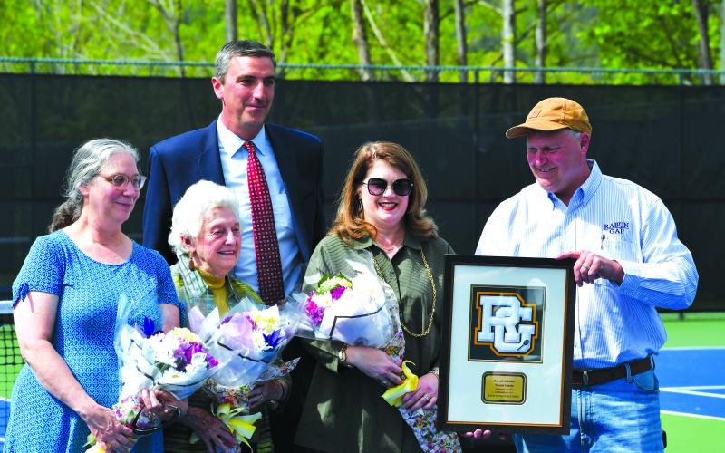 Luke Morey/The Clayton Tribune. From left, Ruth Arbitter Ebbs, Kathleen Arbitter, RGNS Head of School Jeff Miles, Jennifer Arbitter and Stephen Arbitter. During the re-dedication of Donald Arbitter tennis courts, the Arbitter family was honored with a Rabun Gap plaque in memory of Don Arbitter.