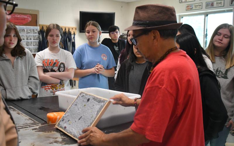 Megan Broome/The Clayton Tribune. Artist Javier Silverio, director of Taller Leñateros in Chiapas, Mexico, instructs students in the Rabun County High School art room April 21 on how to make paper using natural materials and dyes.