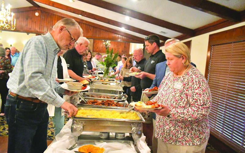 Megan Broome/The Clayton Tribune.  Business and community members who have made important impacts in Rabun County enjoy a one-of-a-kind “build your own biscuit” bar at The Dillard House Conference Center during the Forward Rabun/Rabun County Chamber of Commerce Community and Business Awards Breakfast on May 16.