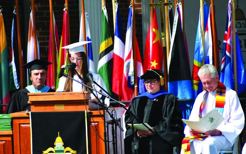 Luke Morey/The Clayton Tribune. Rabun Gap senior Catherine Childs read verses from the Bible to help begin the Rabun Gap graduation ceremonies.