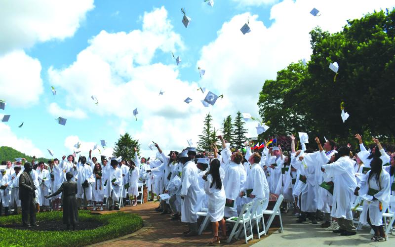 Luke Morey/The Clayton Tribune. The 100 Rabun Gap graduates toss their caps in the air on Sunday, May 21, as they celebrate their graduation. The commencement ceremonies also included a baccalaureate speech, given by Rev. Dr. Jeffry Lynn Reynolds. The Rabun Gap seniors helped achieve two back-to-back state championships as well as the Shuler Award for the arts program, on top of all 100 earning acceptance into a four-year college or university.