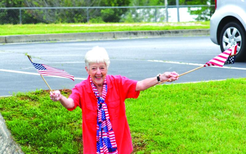 Enoch Autry/The Clayton Tribune. Residents in Tiger and throughout the county waved American flags and said “thanks for serving” to those who drove in the Armed Forces Day Convoy on May 20.