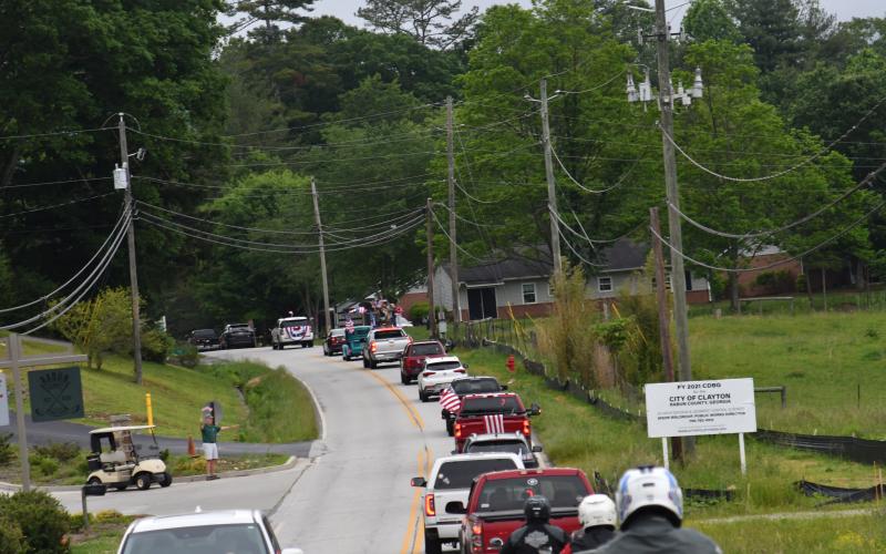 Enoch Autry/The Clayton Tribune. Residents in Tiger and throughout the county waved American flags and said “thanks for serving” to those who drove in the Armed Forces Day Convoy on May 20. Residents in Tiger and throughout the county waved American flags and said “thanks for serving” to those who drove in the Armed Forces Day Convoy on May 20.