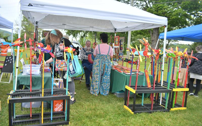 Megan Broome/The Clayton Tribune. Several people enjoy the folk art of Charlie Dingler at the inaugural Dinglerfest Saturday, May 6.