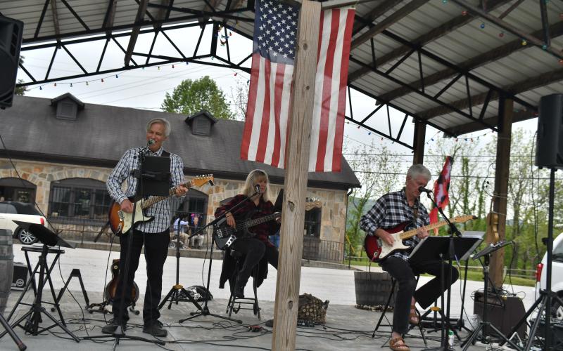 Megan Broome/The Clayton Tribune. Visitors and exhibitors at Dinglerfest in Dillard Saturday, May 6 enjoyed music by the group “Playing it Forward Trio.” The group plays 100 percent for charity, with all fees and tips benefiting Rabun County charities. Members are Karen Bacon, David Bacon and Greg Presmanes.
