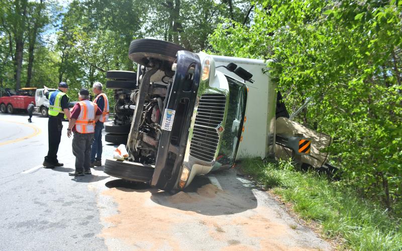Megan Broome/The Clayton Tribune. Sky Valley Police Chief Vaughn Estes, Sky Valley-Scaly Mountain Volunteer Fire &amp; Rescue Chief Ken Sigler and firefighters analyze the crash scene on Highway 246 just past Sky Valley Overlook in Macon County, North Carolina limits Monday, May 1.