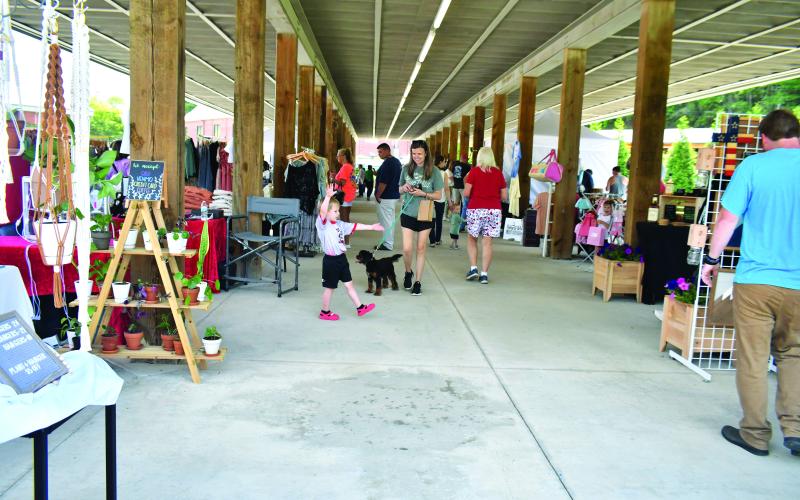 Megan Broome/The Clayton Tribune. Over 100 artisans with their handmade crafts  were featured at the second annual Of These Mountains Spring MarketPlace in Clayton Saturday, May 13. Crowds of people showed out to enjoy the community event featuring unique creations.