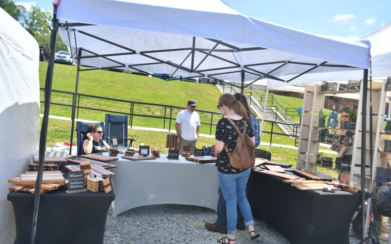 Megan Broome/The Clayton Tribune. South Eastern Wood Working owned by Matthew Walker had many beautiful creations on display for community members to view at the Of These Mountains Spring MarketPlace event Saturday, May 13.