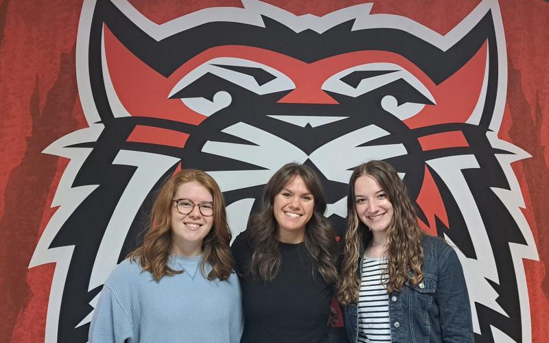 Megan Broome/The Clayton Tribune. Valedictorian Skylar Krockum, Salutatorian Bailey Maloney and Historian Hailey Hutcheson lead Rabun County’s graduating class.