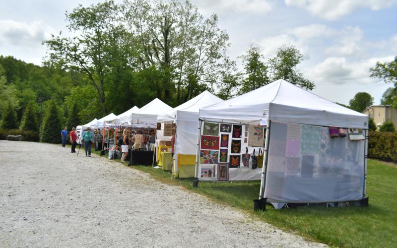 Megan Broome/The Clayton Tribune. The inaugural Sassafras Artisan Market presented by the North Georgia Arts Guild featured artists showcasing hand-made jewelry, photography, watercolor paintings, pottery, folk art, wood and metal art, fiber art, and much more. Crowds of people came out to enjoy the event April 29-30 weekend. It featured artists inside the Rabun County Civic Center and outside at the pavilions.