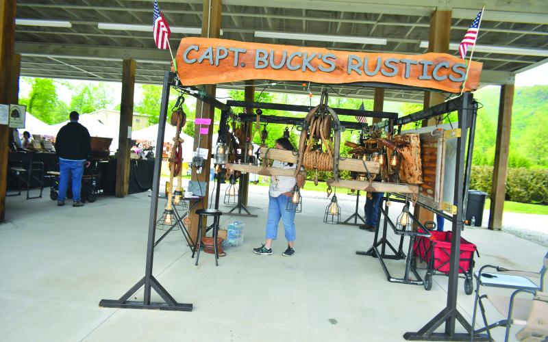 Megan Broome/The Clayton Tribune. Capt. Buck’s Rustics features handcrafted unique lights &amp; More at the inaugural Sassafras Artisan Market in Clayton April 29-30.
