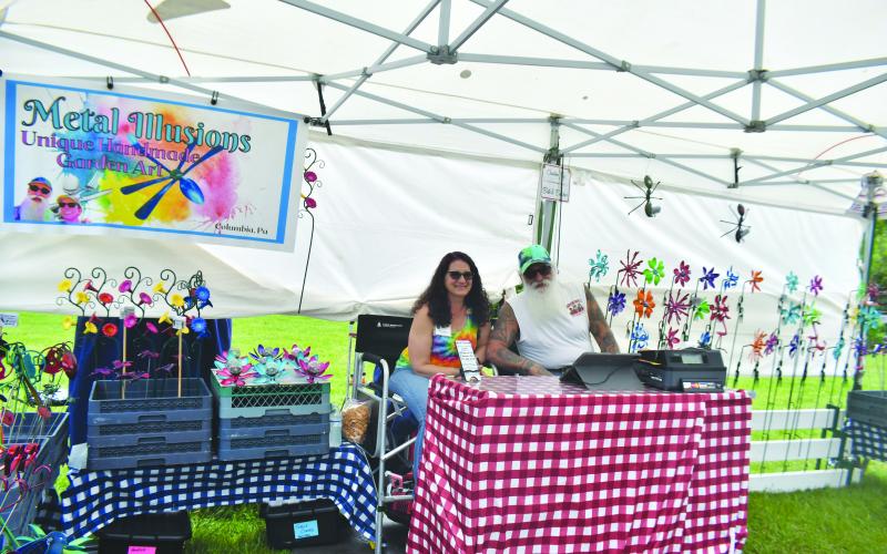 Megan Broome/The Clayton Tribune. Butcher and Beth with Metal Illusions take the ordinary and make it extraordinary by creating unique yard and home art from metal utensils. They display their works of art at the Sassafras Artisan Market in Clayton April 29-30.