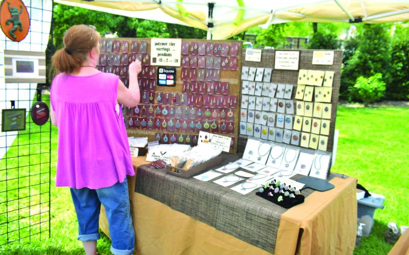 Megan Broome/The Clayton Tribune. Erika White with EW Designs is a Polymer clay artist and displays her artwork at Sassafras Artisan Market in Clayton April 29-30.