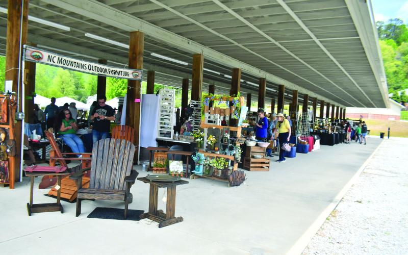 Megan Broome/The Clayton Tribune. The inaugural Sassafras Artisan Market presented by the North Georgia Arts Guild featured artists showcasing hand-made jewelry, photography, watercolor paintings, pottery, folk art, wood and metal art, fiber art, and much more. Crowds of people came out to enjoy the event April 29-30 weekend. It featured artists inside the Rabun County Civic Center and outside at the pavilions.