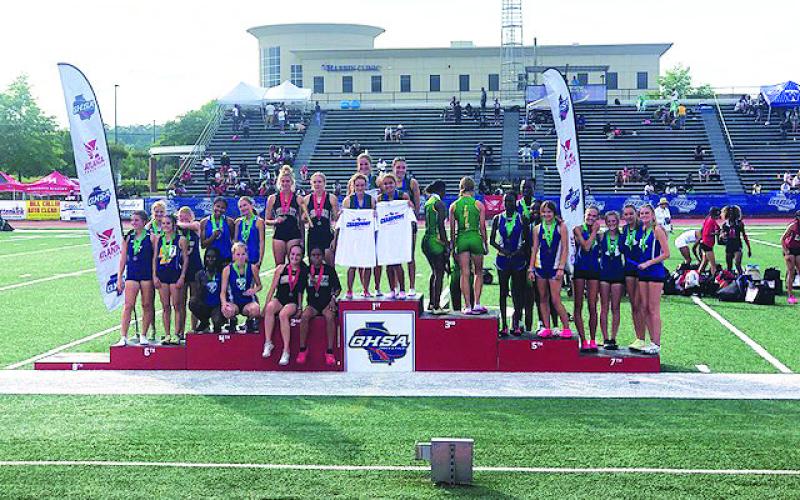 TFS photo. The Tallulah Falls School girls 4X400 relay team (center) -- composed of Dani Prince, Sofia Rueda, Molly Mitchell and Julianne Shirley -- won the state championship in Rome on May 13 with a time of 4:07.70. The Lady Indians took 10th place overall, while the Indians took 25th.
