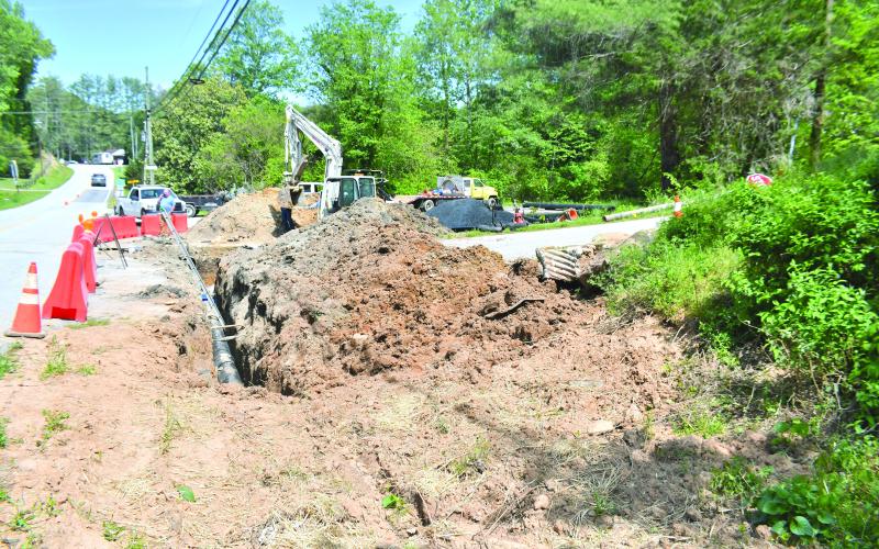 Megan Broome/The Clayton Tribune. Mack Jones Enterprises, out of Flowery Branch, Ga., works with City of Clayton Public Works on Old Highway 441 in the area of Hillside Drive and Summit Drive in Clayton on infrastructure repairs for better water quality and fire protection. Motorists are asked to use caution and slow down while workers are in the area.