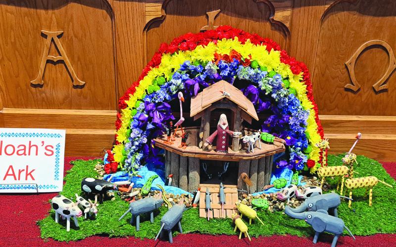 Megan Broome/The Clayton Tribune. This depiction of Noah’s Ark in colorful flowers and crafted animals was created by parishioners at St. James Episcopal Church and arranged in front of the altar during the Flower and Liturgical Festival.