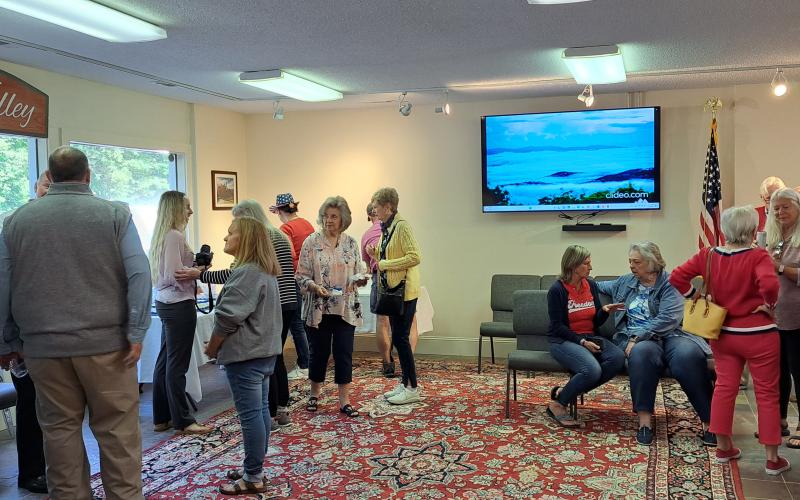 Megan Broome/The Clayton Tribune. Community members tour the newly renovated Sky Valley City Hall facility during the ribbon-cutting and grand opening event. The building will function as City Hall, Sky Valley Visitors Center, council chambers and municipal court.