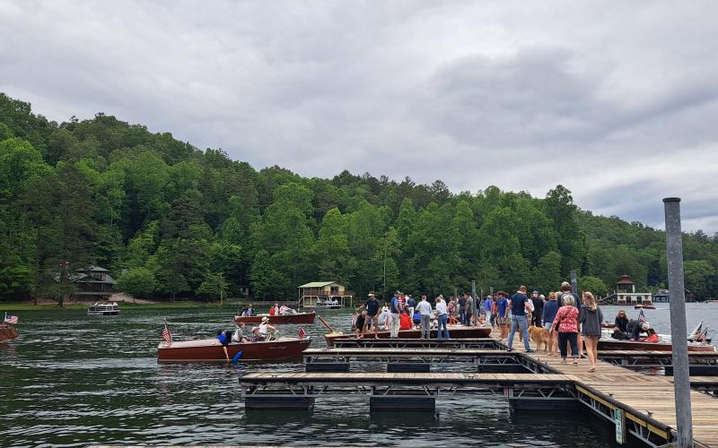 Megan Broome/The Clayton Tribune. Hundreds of people show out to LaPrade's Marina at Lake Burton to view wooden boats on display following the annual Memorial Day parade.