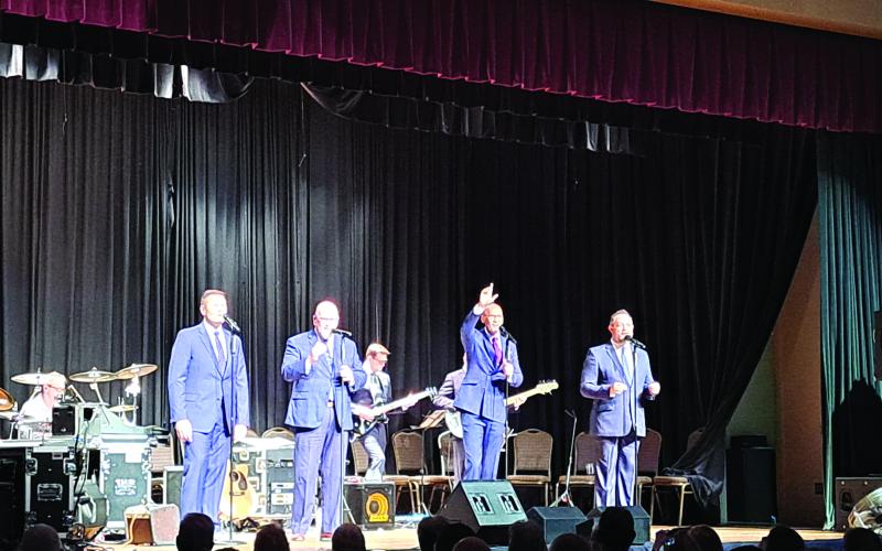 Megan Broome/The Clayton Tribune. Phil Cross &amp; Poet Voices praised God during the Gospel music concert.