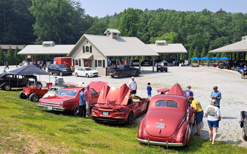 Megan Broome/The Clayton Tribune. The Inaugural "Rumble in Rabun" car and bike show featured 106 entires. Spectators locally, from around the region and surrounding states attended the event. Left: Show judge Jason Whitmire talks with Bruce Martin from Rabun Gap about his Wood Doodlebug Chevette.