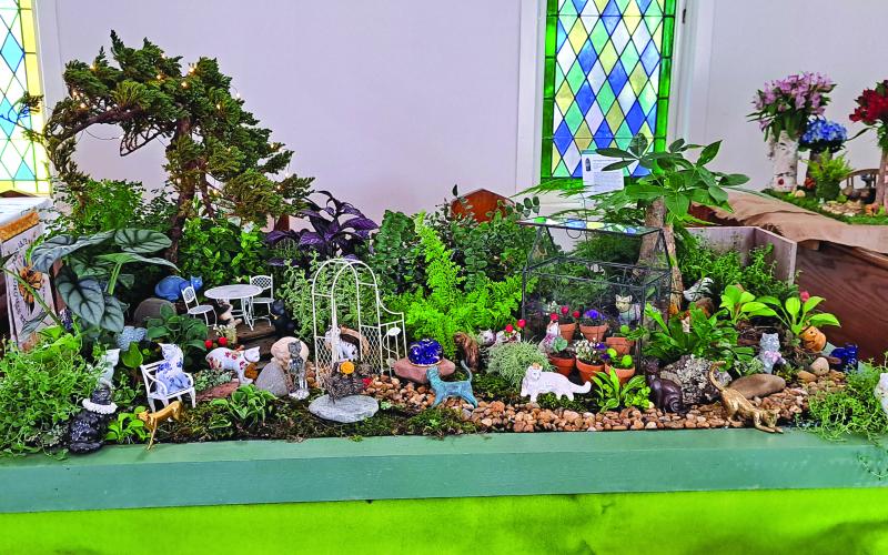 Megan Broome/The Clayton Tribune. The beautiful display depicting “Cats in the Garden” was featured during the Flower and Liturgical Festival last Friday and Saturday.